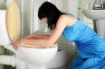 Young caucasian woman in toilet