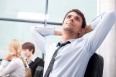 Closeup portrait of a smart young businessman smiling and his co