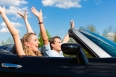 Young couple with cabriolet in summer on day trip