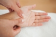 Woman receiving a hand massage at the health spa