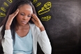 Woman with headache against black background