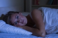 Woman  trying to sleep at night in the bedroom